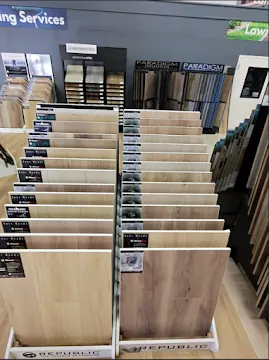 Vinyl plank flooring sample display boards in a showroom