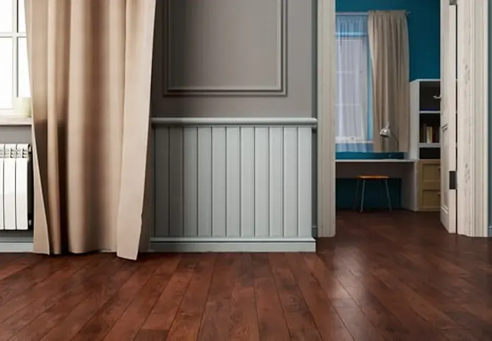 Dark luxury vinyl plank flooring installed in a Vacaville home with white wainscoting